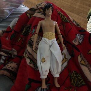 Aladdin Disney doll with white pants